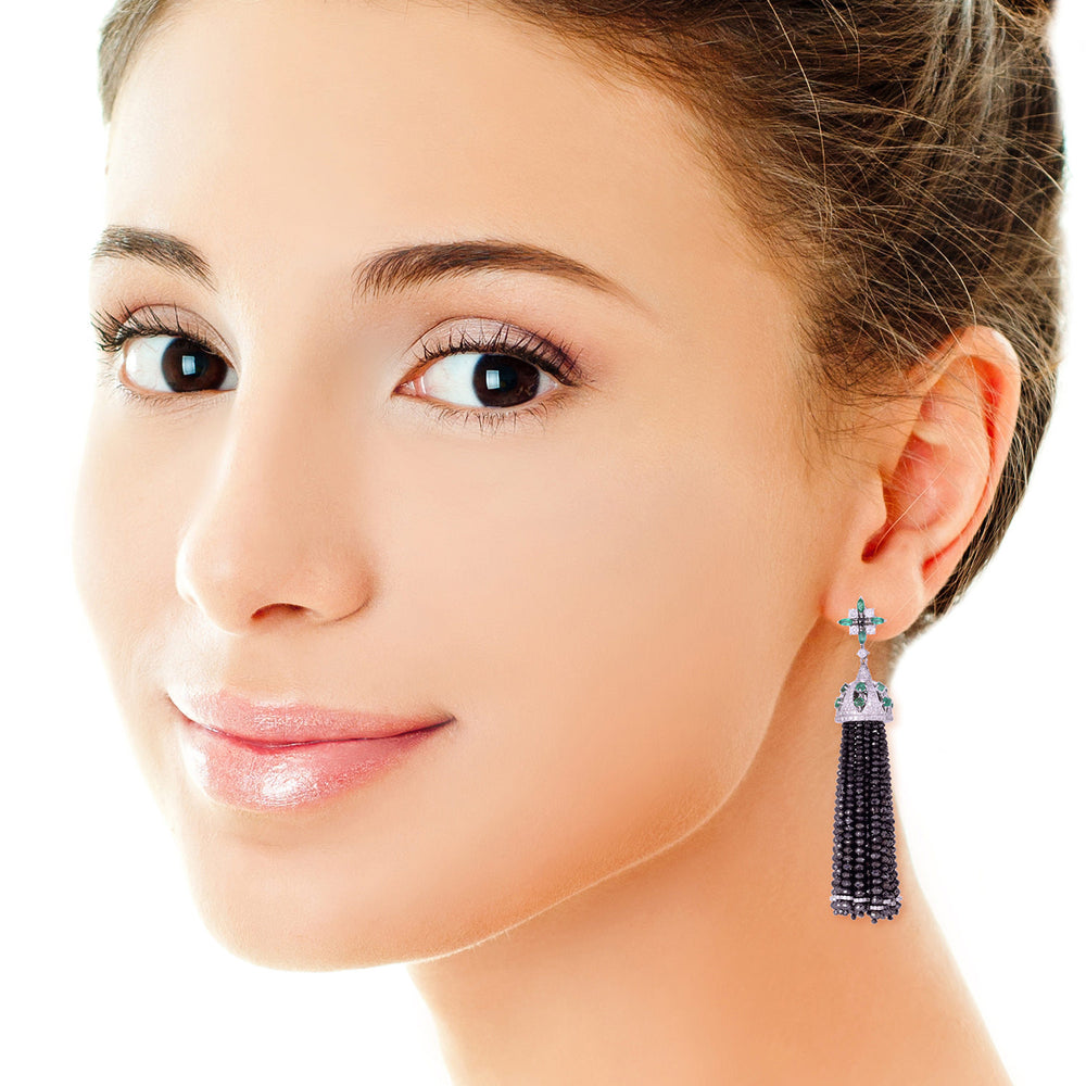 Black And White Diamond Tassel Earrings with Emerald Accents in 18K White Gold