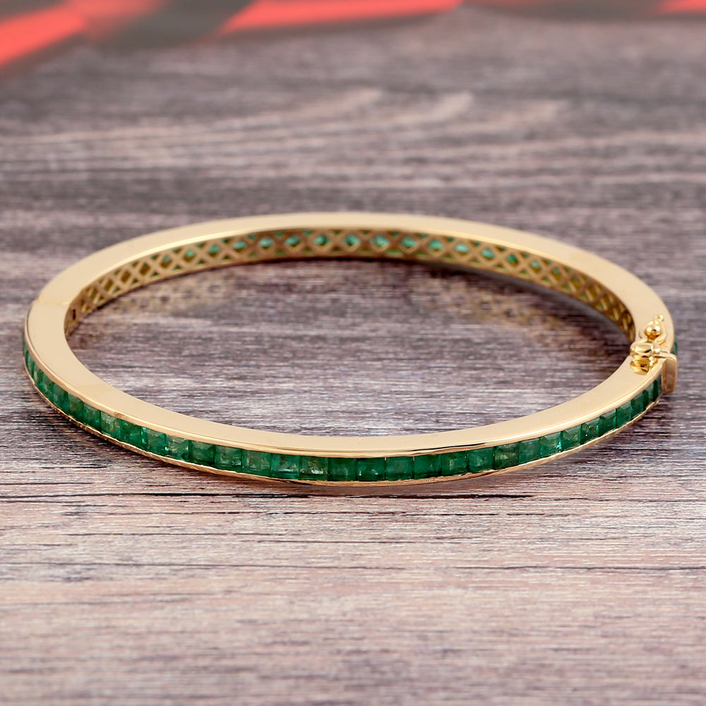 Channel Set Emerald Sleek Bangle Bracelet For Her In 18k Yellow Gold