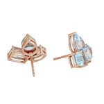 Blue Topaz Three Stone Stud Earrings In 18k Rose Gold